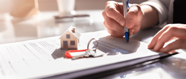 A person signs documents at a table, where a small house model and keys sit prominently. Nearby, notes on property line disputes suggest careful consideration of boundaries in the transaction.